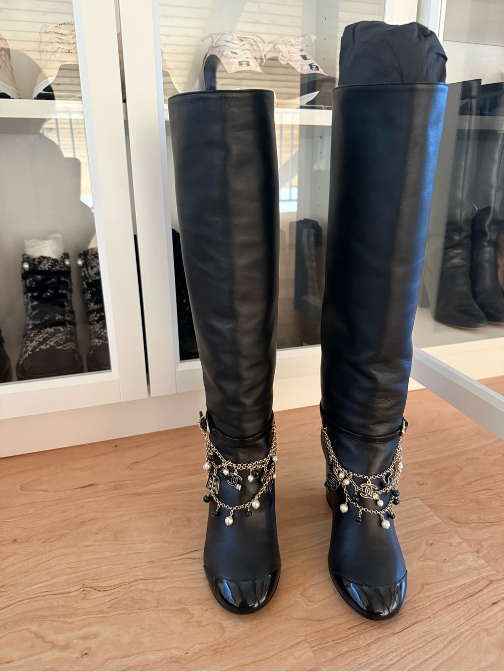 CHANEL Black Over-the-Knee Leather Boots with Chain Charm Trim